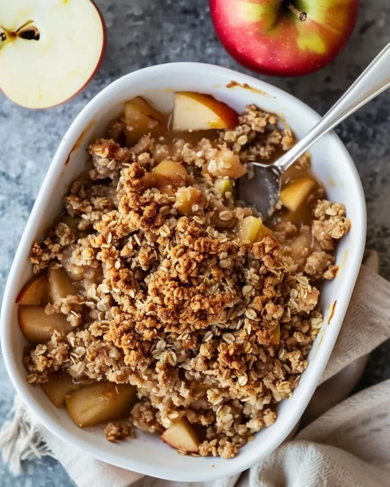 Healthy breakfast apple crumble topped with oats and fresh apples