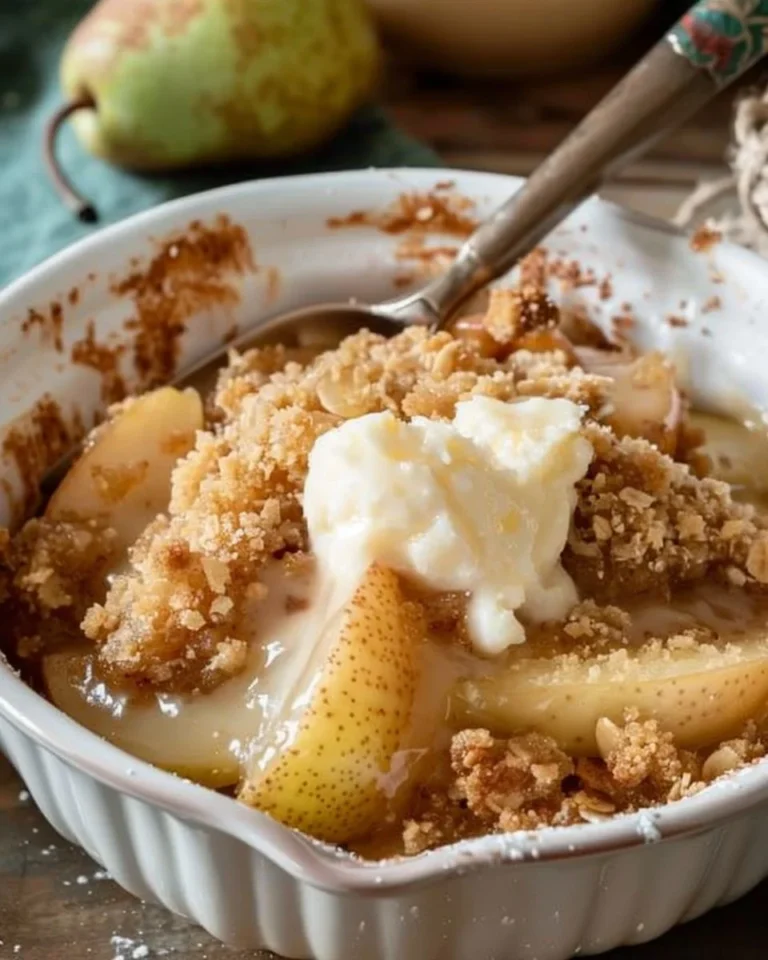 Baked old fashioned pear crumble dessert with a crunchy topping