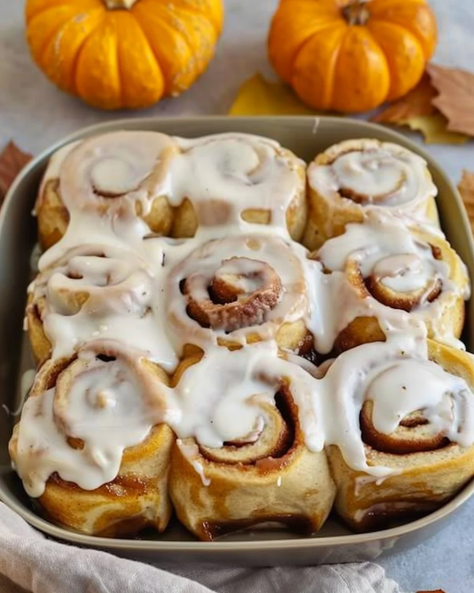 Delicious sourdough pumpkin cinnamon rolls with maple cream cheese frosting.